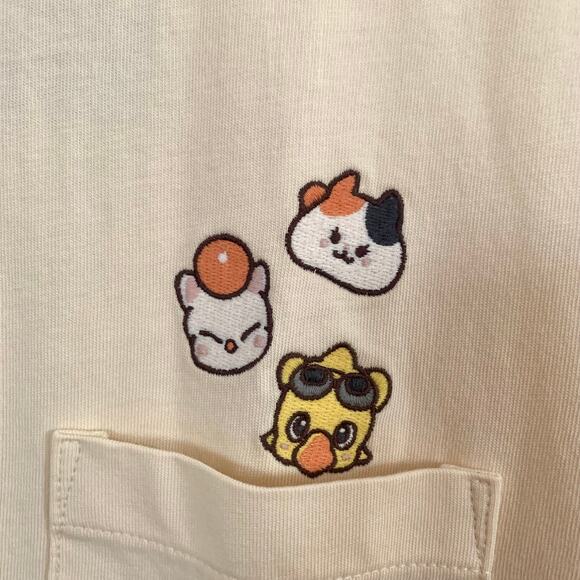 Uniqlo Final Fantasy 14 FFXIV Chocobo Moogle Fat Cat Pocket T-shirt in Natural - Picture 7 of 12